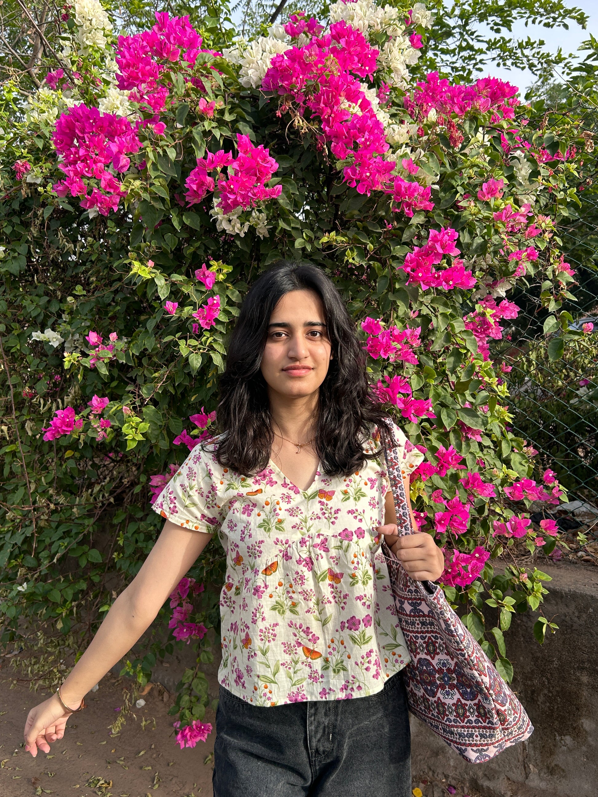 GULNAARI printed cotton top styled with black jeans and boho sling bag