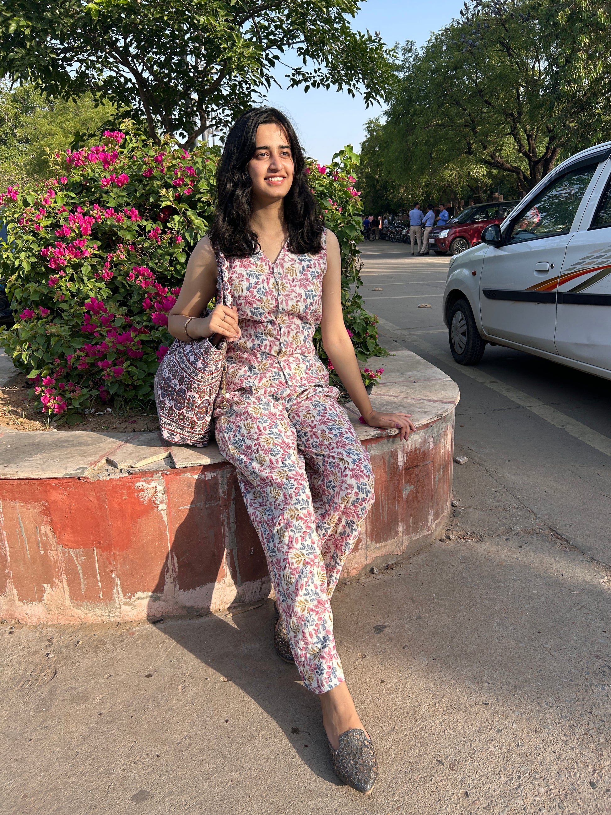 Woman wearing cotton floral co-ord set with sleeveless top and wide-leg pants – Botanical Bloom summer outfit