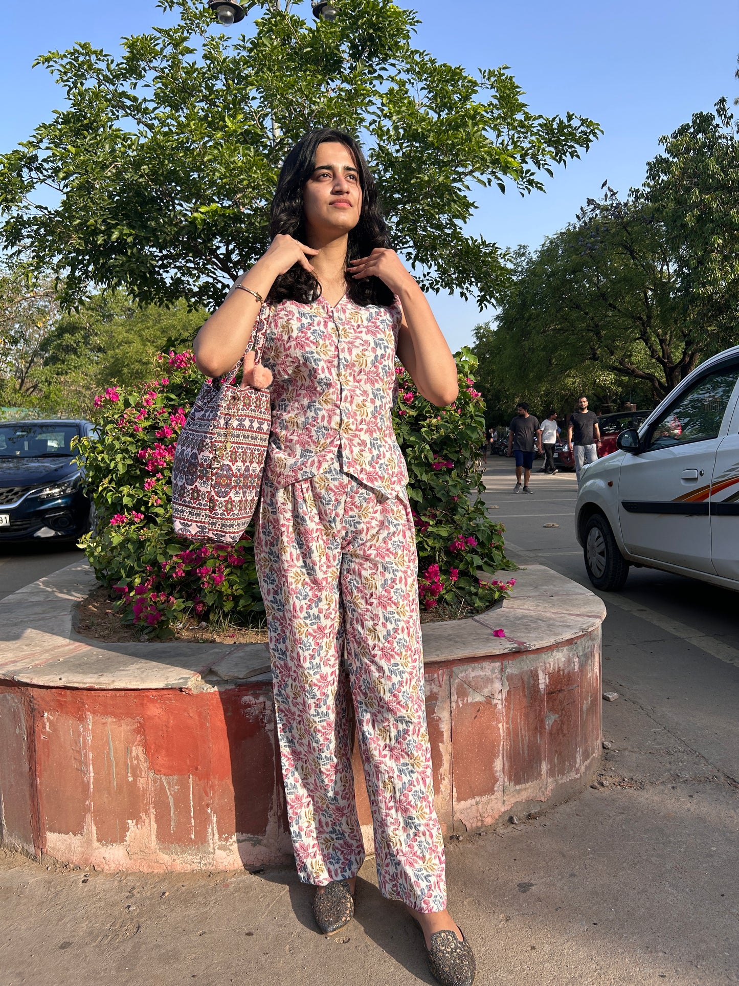 Woman wearing cotton floral co-ord set with sleeveless top and wide-leg pants – Botanical Bloom summer outfit