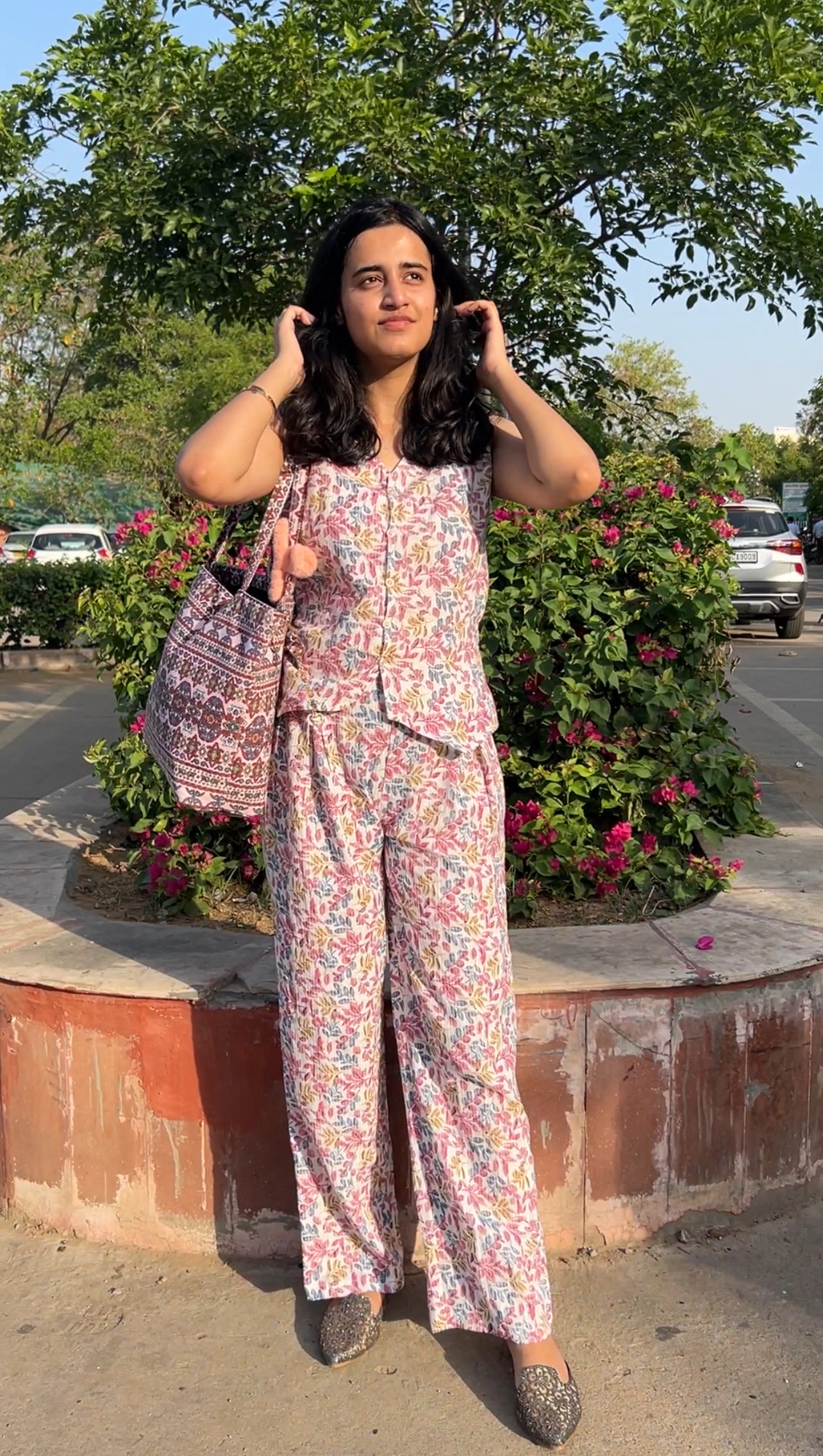 Woman wearing cotton floral co-ord set with sleeveless top and wide-leg pants – Botanical Bloom summer outfit