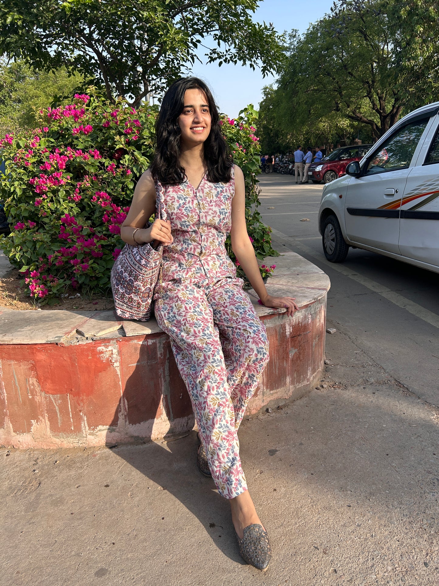 Woman wearing cotton floral co-ord set with sleeveless top and wide-leg pants – Botanical Bloom summer outfit